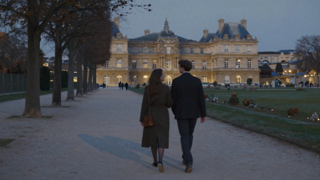 Two people walking peacefully through Luxembourg Gardens at dusk, shadows on cobblestones.